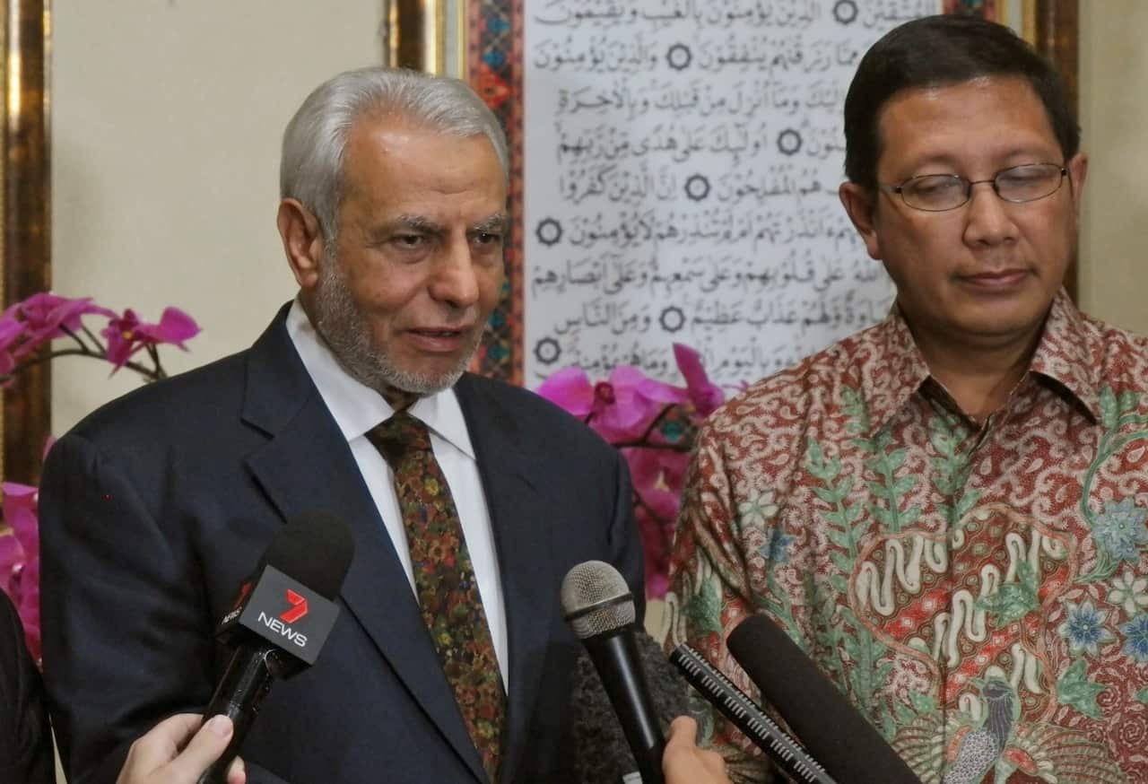 Grand Mufti of Australia Ibrahim Abu Mohamed, left, talks to the media during a press conference.