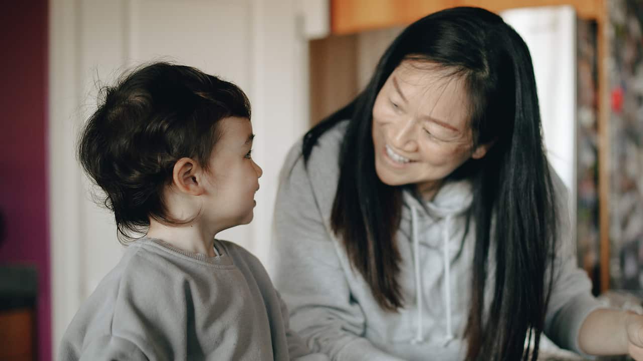Mum and son in the kitchEN