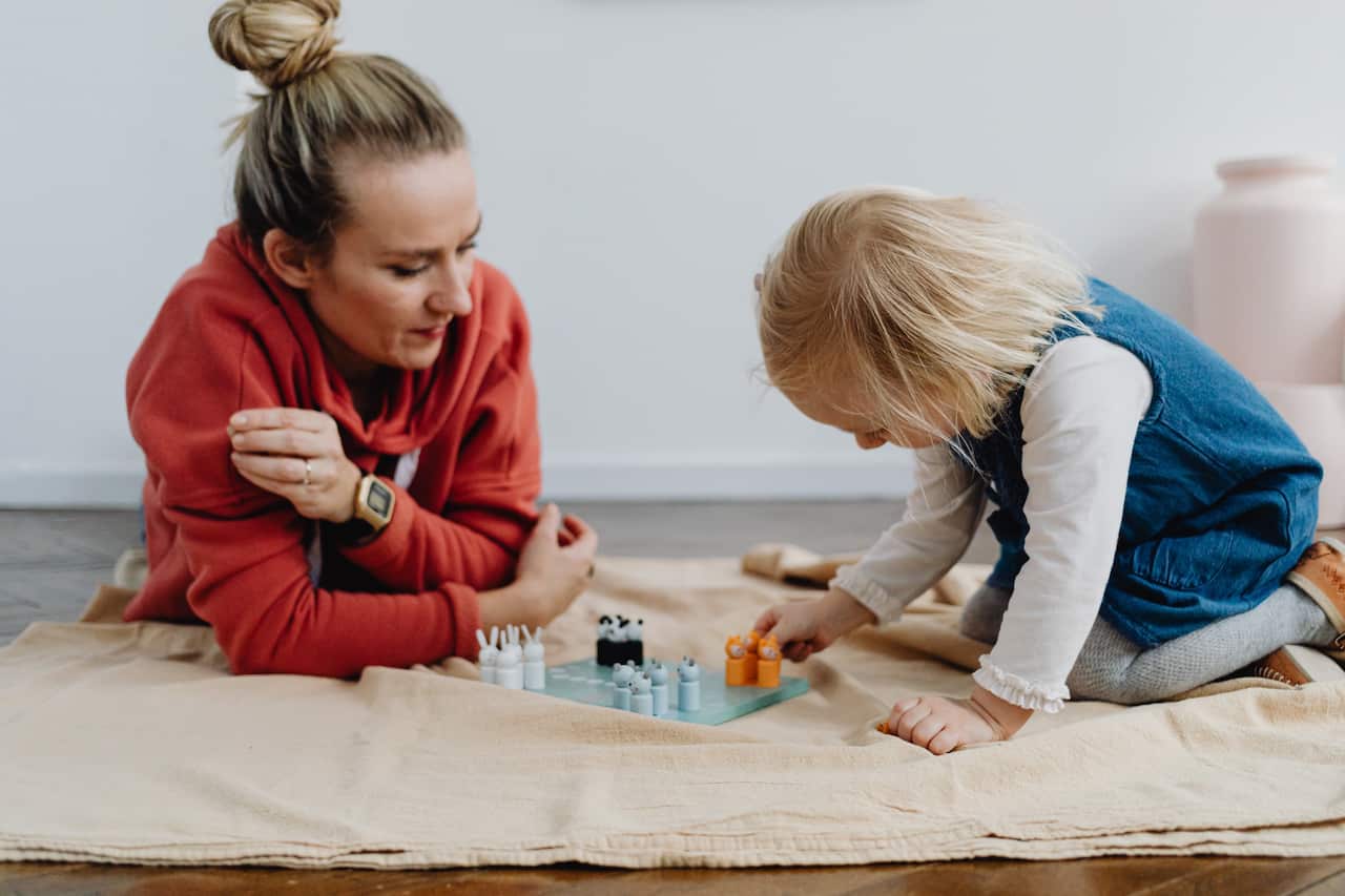 Mum and daughter playing on the floor