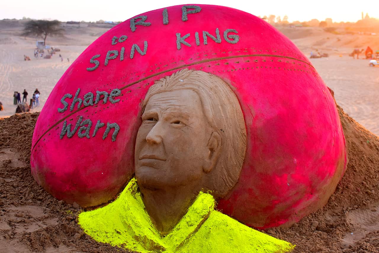 Artist creates a sand sculpture to pay tribute to Australian legendary spinner Shane Warne, who passed away on Friday, in Desert of Pushkar, Rajasthan, India on 5 March 2022.