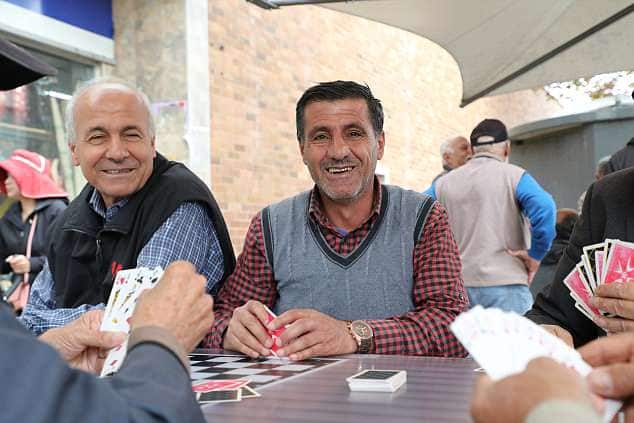 Iraqi men are playing card on the main streets
