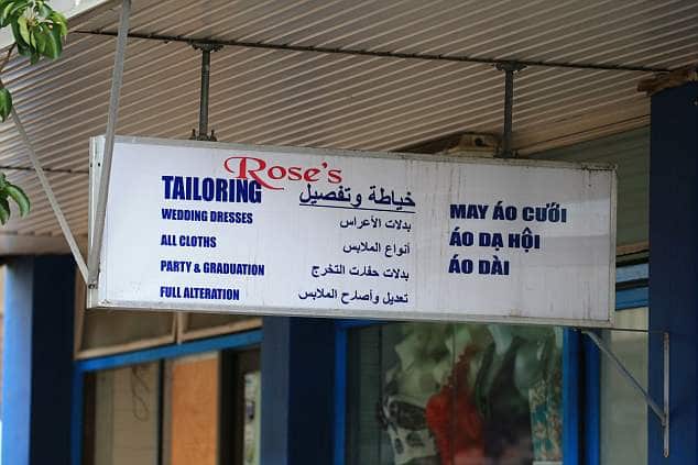 Shop sign with Vietnamese and Arabic language