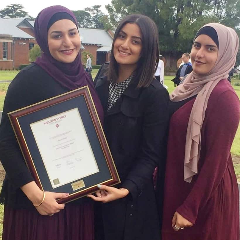 Amani Haydar and her sisters collecting their mother's Salwa Haydar graduation certificate.