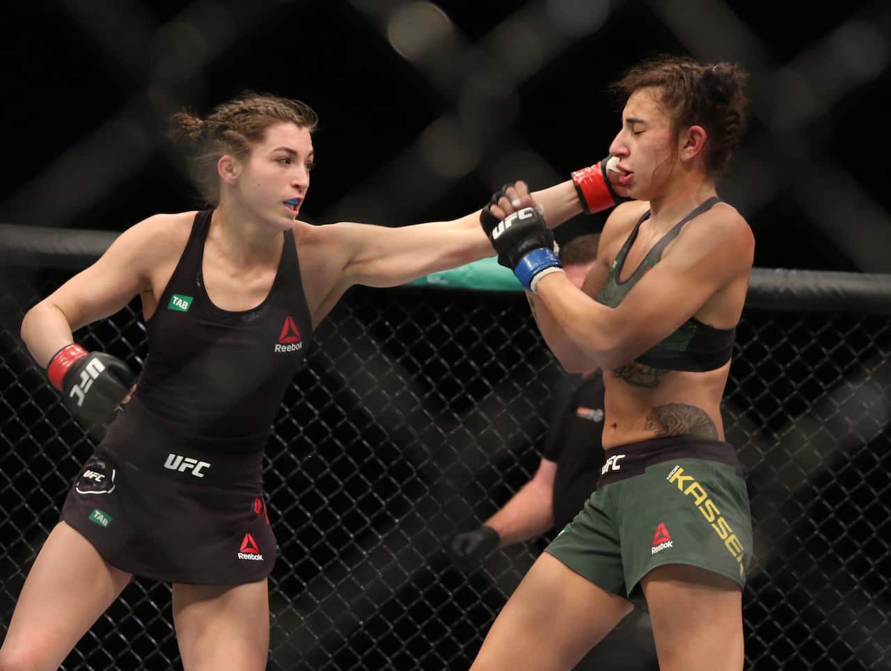 Feb 9, 2019; Melbourne, Australia; Montana De La Rosa (red gloves) and Nadia Kassem (blue gloves) during UFC 234 at Rod Laver Arena. Mandatory Credit: Jasmin Frank-USA TODAY Sports/Sipa USA.