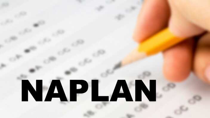 Hand completing a multiple choice exam.