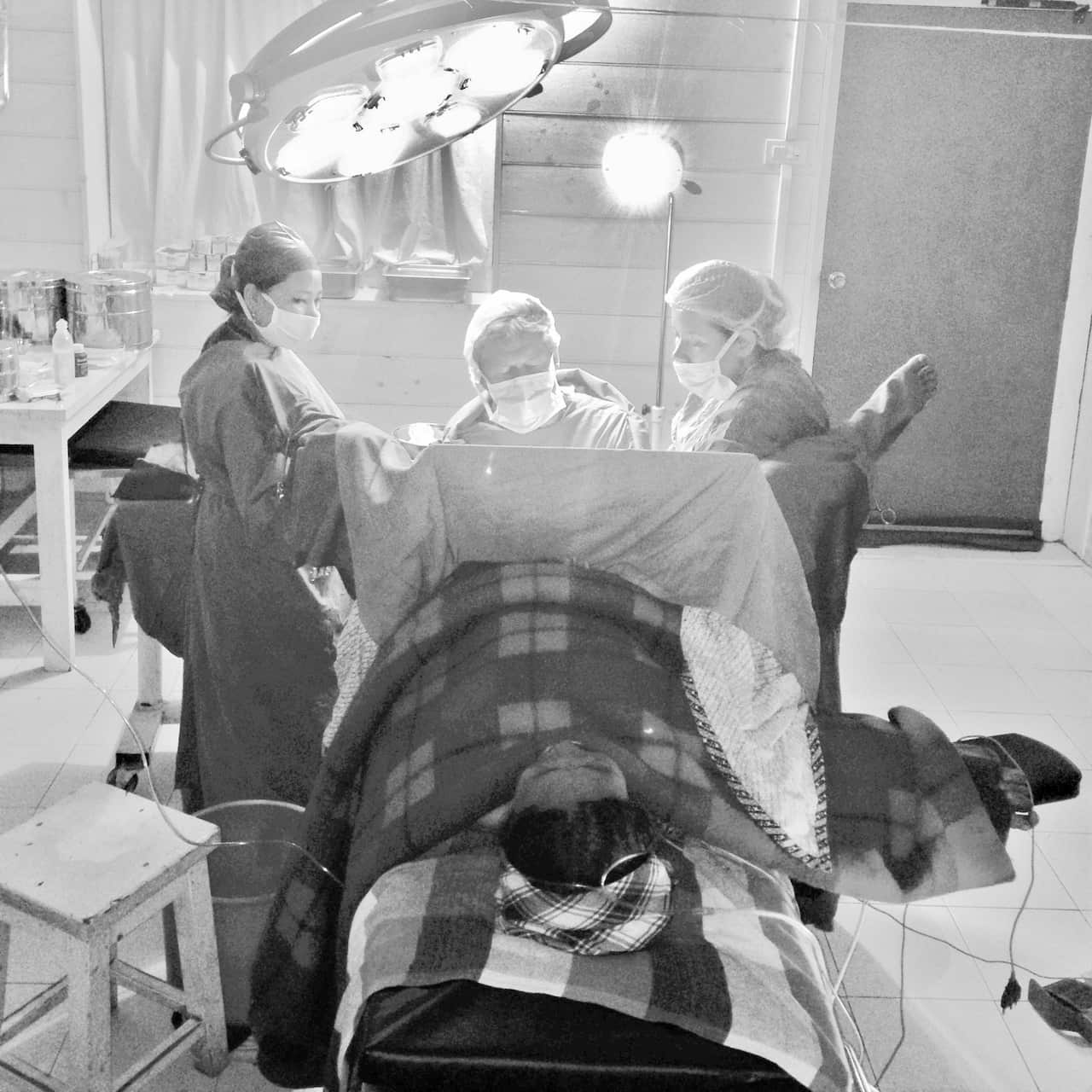 Dr Ray Hodgson on an  operating table