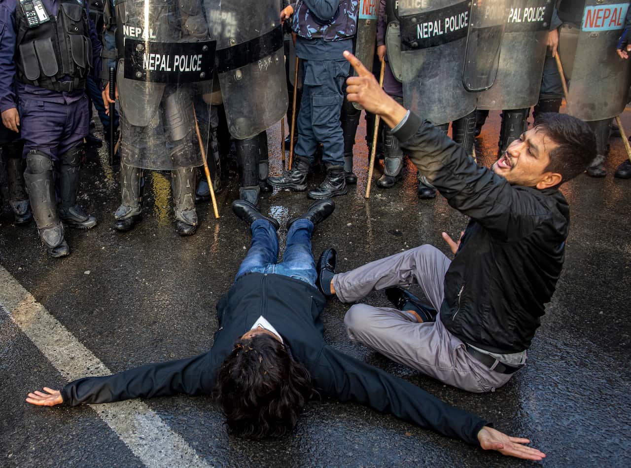 Nepalese police and demonstrators of civic society clash during an anti-government protest in Kathmandu, Nepal, 25 January 2021.
