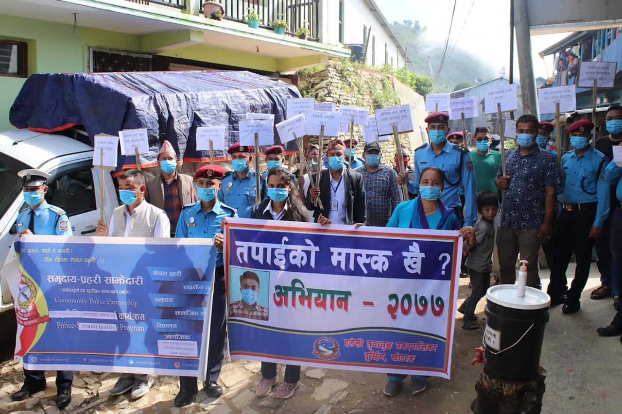 Nepal police and community members join in to urge people to wear mask to protect from coronavirus