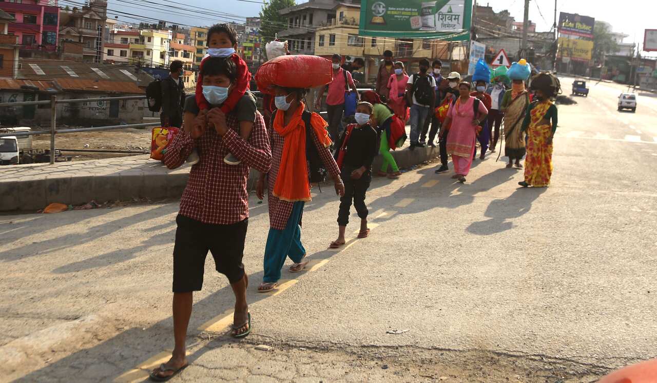 Nepal's daily wage workers walk home to remote districts.