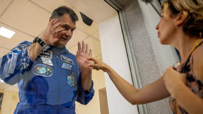 Paolo Nespoli (L) speaks with his wife Alexandra Ryabova (R) after a press conference at the Baikonur Cosmodrome, Kazakhstan, 27 July 2017. 