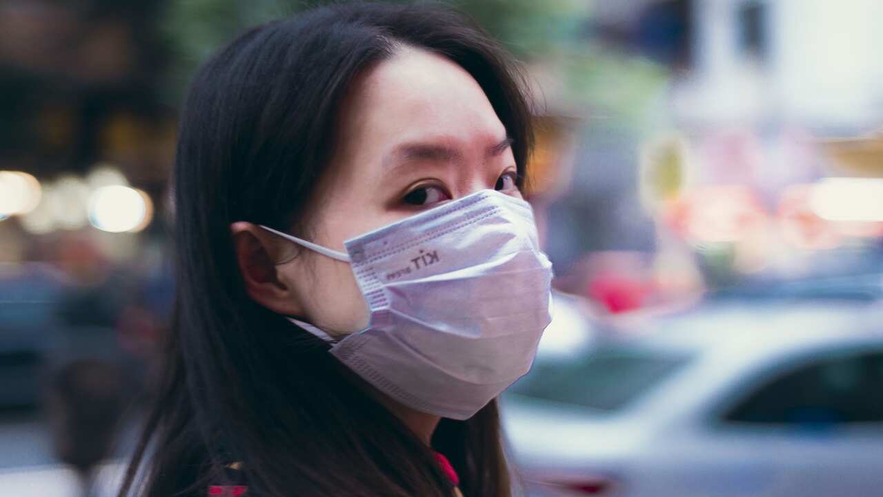 Virtually everyone in Guangzhou wears a face mask in the public.