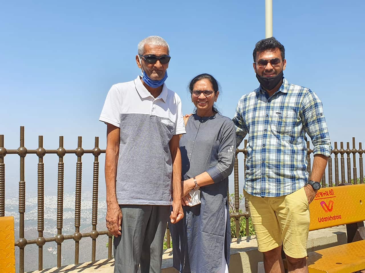 Nijesh Hirpara (R) with his parents