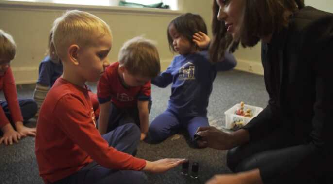 Boys get their nails painted at a school in Reykjavik.