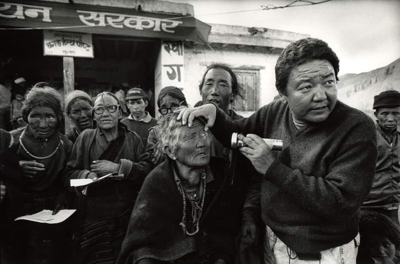Dr Ruit examines the eyes of his patients in Nepal in September of 1992