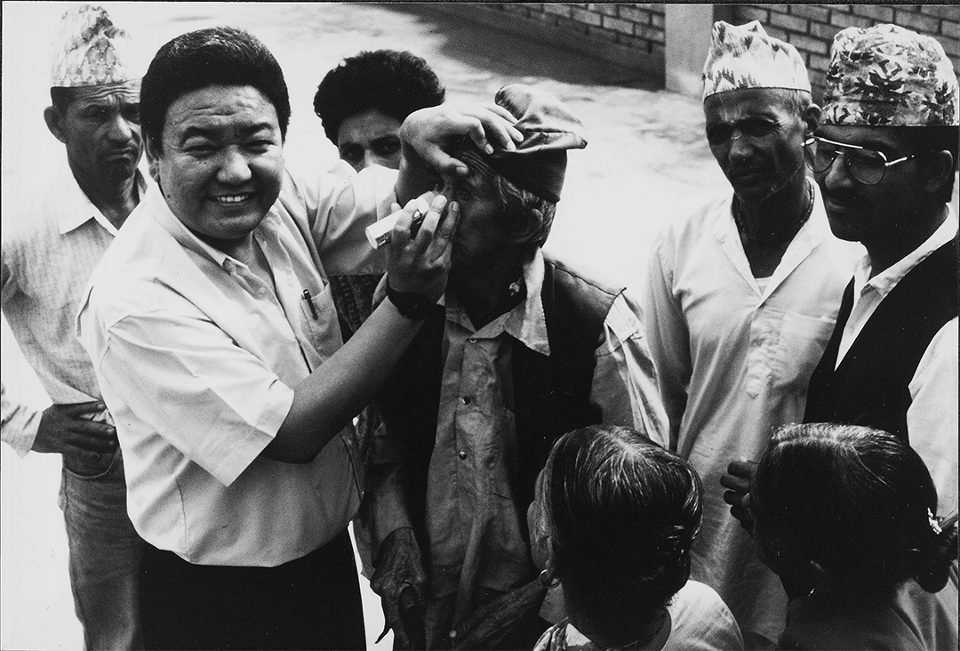 Dr Ruit examines patients' eyes in Nepal, in late December of 1991.