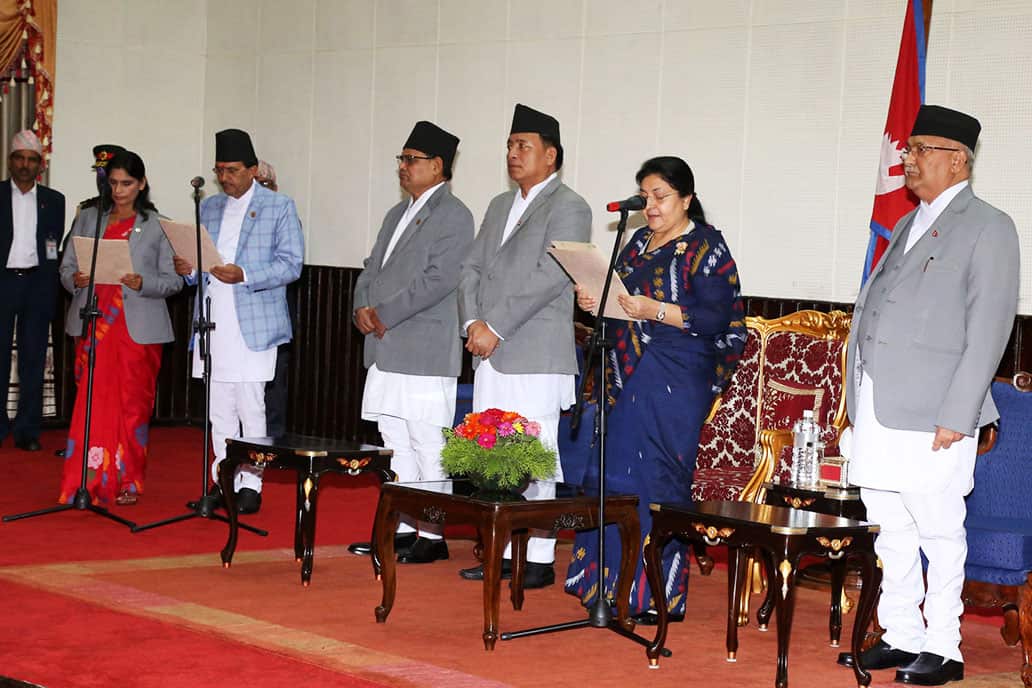 Nepal's President swearing in ministers Padma Aryal and Bhanubhakta Dhakal in Kathmandu.