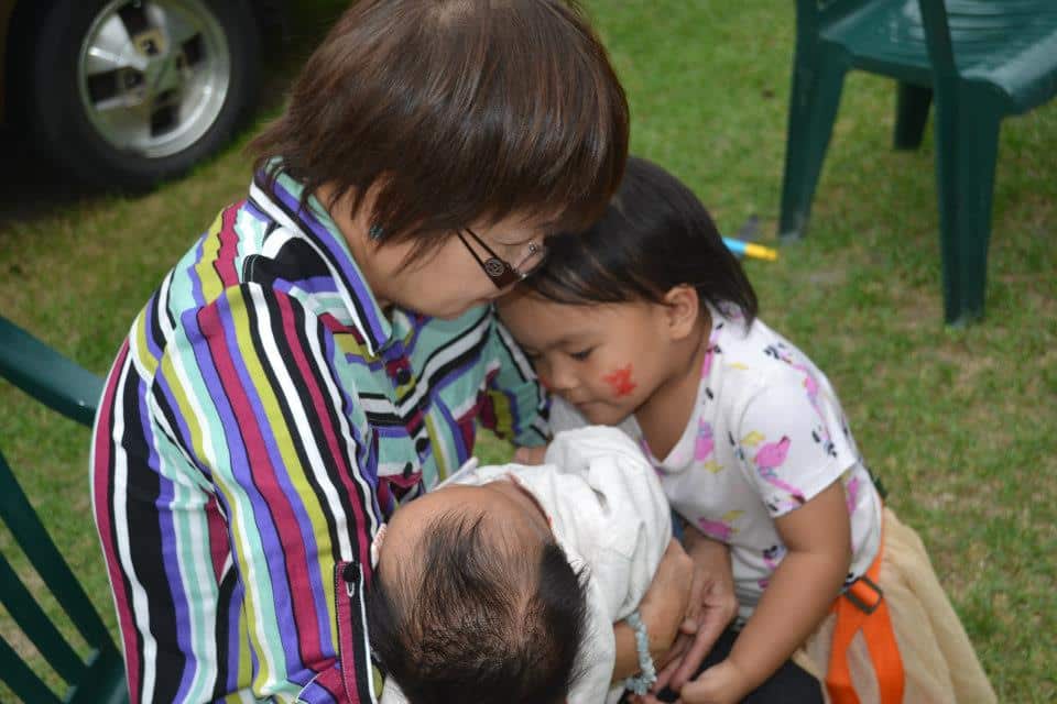 Ofelia Manongdo with her grandchildren