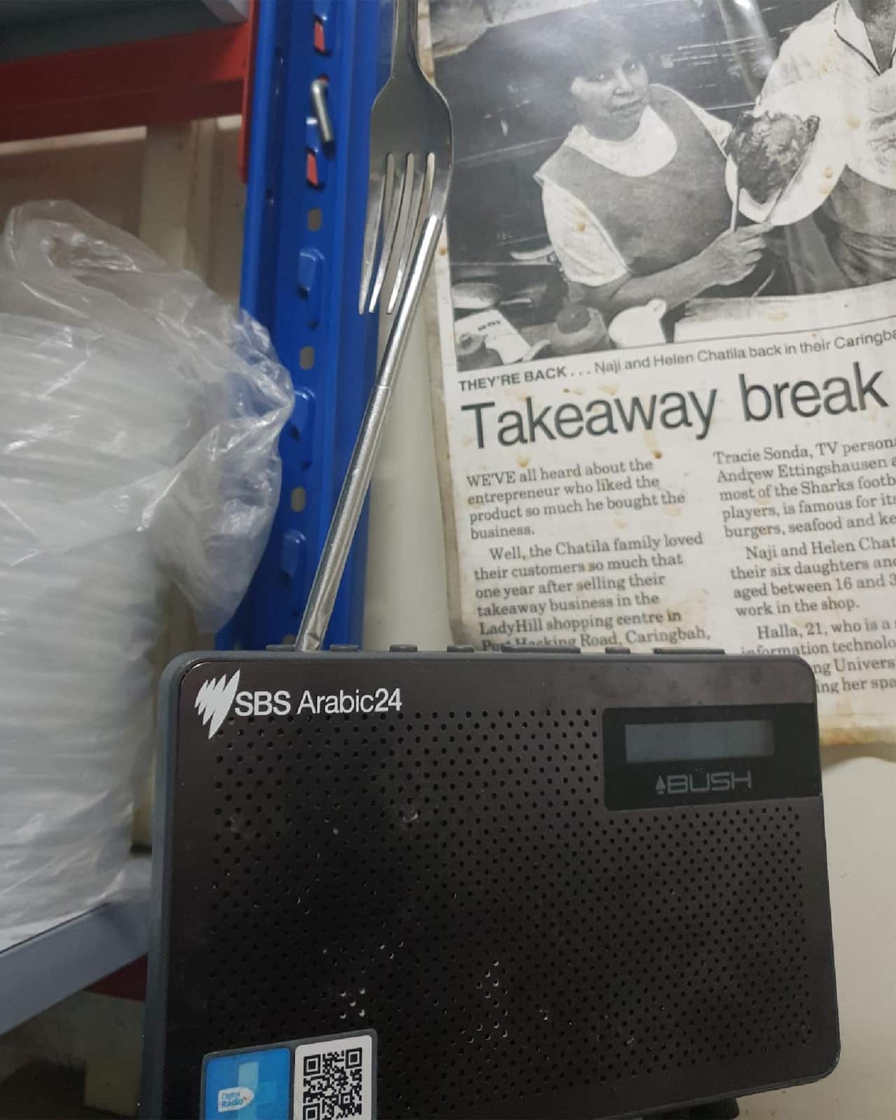 Kamal's old radio held up by a fork.
