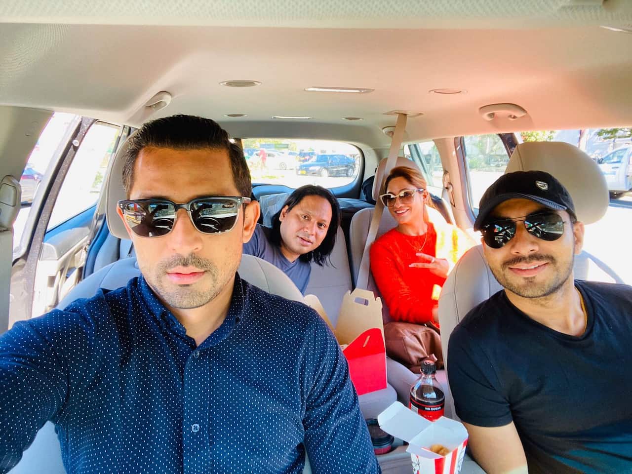 Om Shrestha (1st on right) with other Nepalis, returning to Sydney in a rental car after completing 14 day mandatory quarantine in Brisbane.