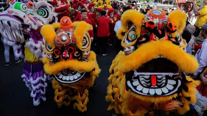 Lion dancers take part the parade during the Chinese Lunar New Year or Spring Festival celebration at Chinatown in Yangon, Myanmar.