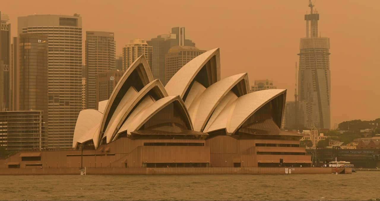 Smoke haze from bushfires in New South Wales blankets the CBD and Sydney Opera House in Sydney, Friday, December 6, 2019.