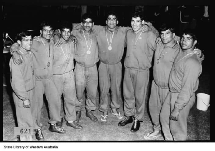 Pakistan's wrestling squad smile for a photo after they won 7 gold and 1 silver medal in wrestling at the 1962 Perth Commonwealth Games.