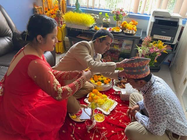 Nepali origin Hindu priest Prakash Dhodari (centre) celebrating Dashain festival in Sydney with his family 