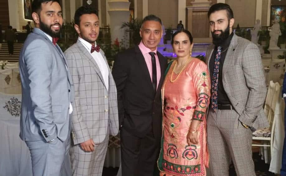 Mr Pangly with his three sons and wife.