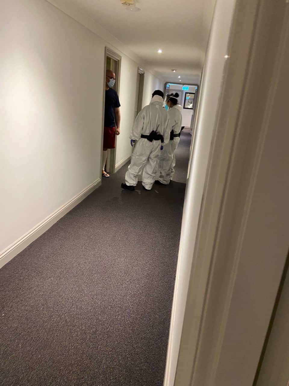 A detainee being looked over at the Park Hotel in Melbourne.