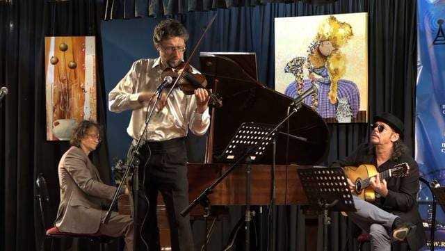 Alex Parkmen at the piano with Leo Novikov, violin and Slava Bilash, guitar