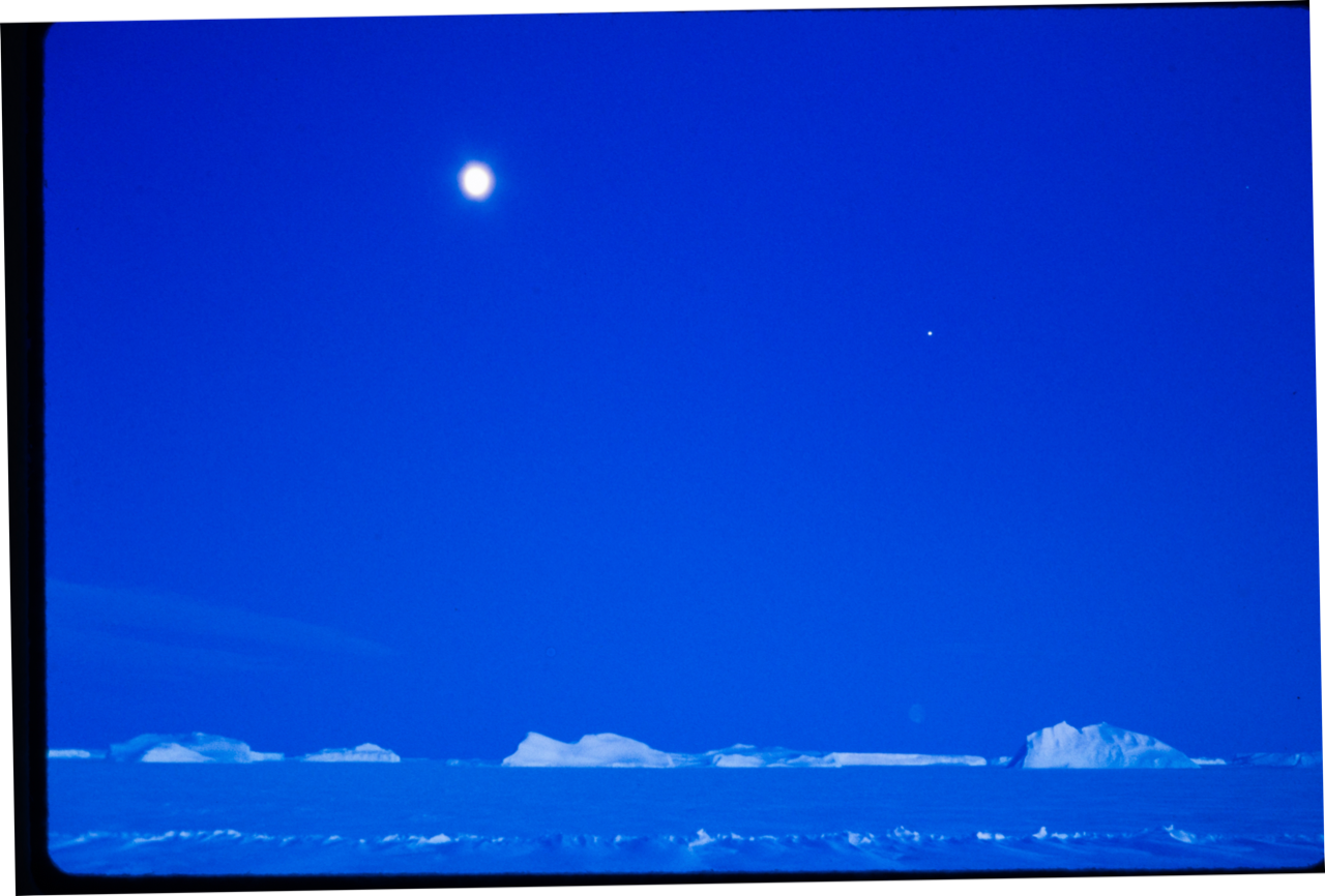 The photo taken in Antarctica. The world of snow and ice has a monotone look, but also colourful in a way.