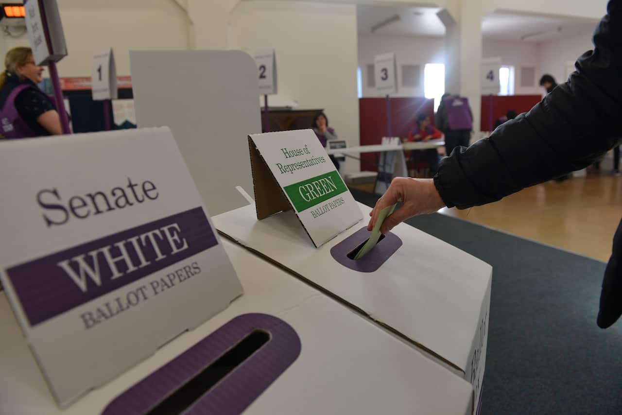 People cast their votes at a polling station during general elections in Melbourne, Australia