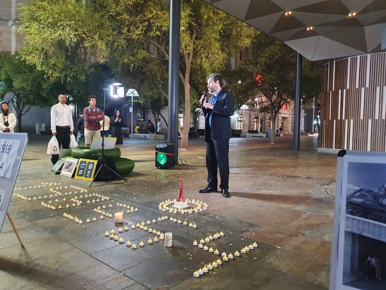 A speaker addressing crowd at a Tiananmen vigil in Perth. 