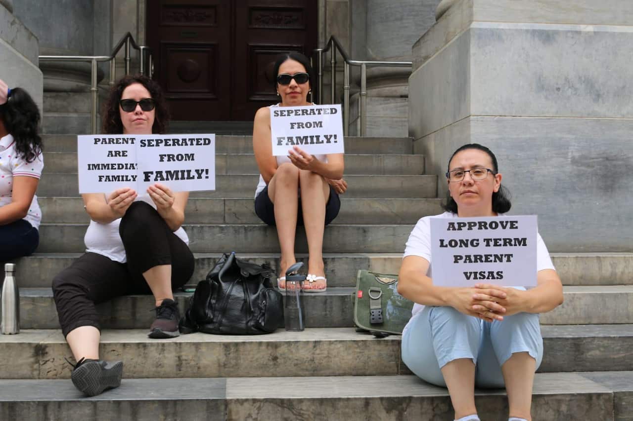 Protesters at the Parliament House in Adelaide calling for parents be considered immediate family members.