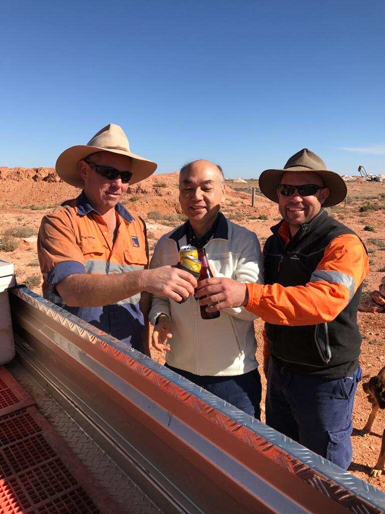Chinese opal trader Tony Wong (centre). 