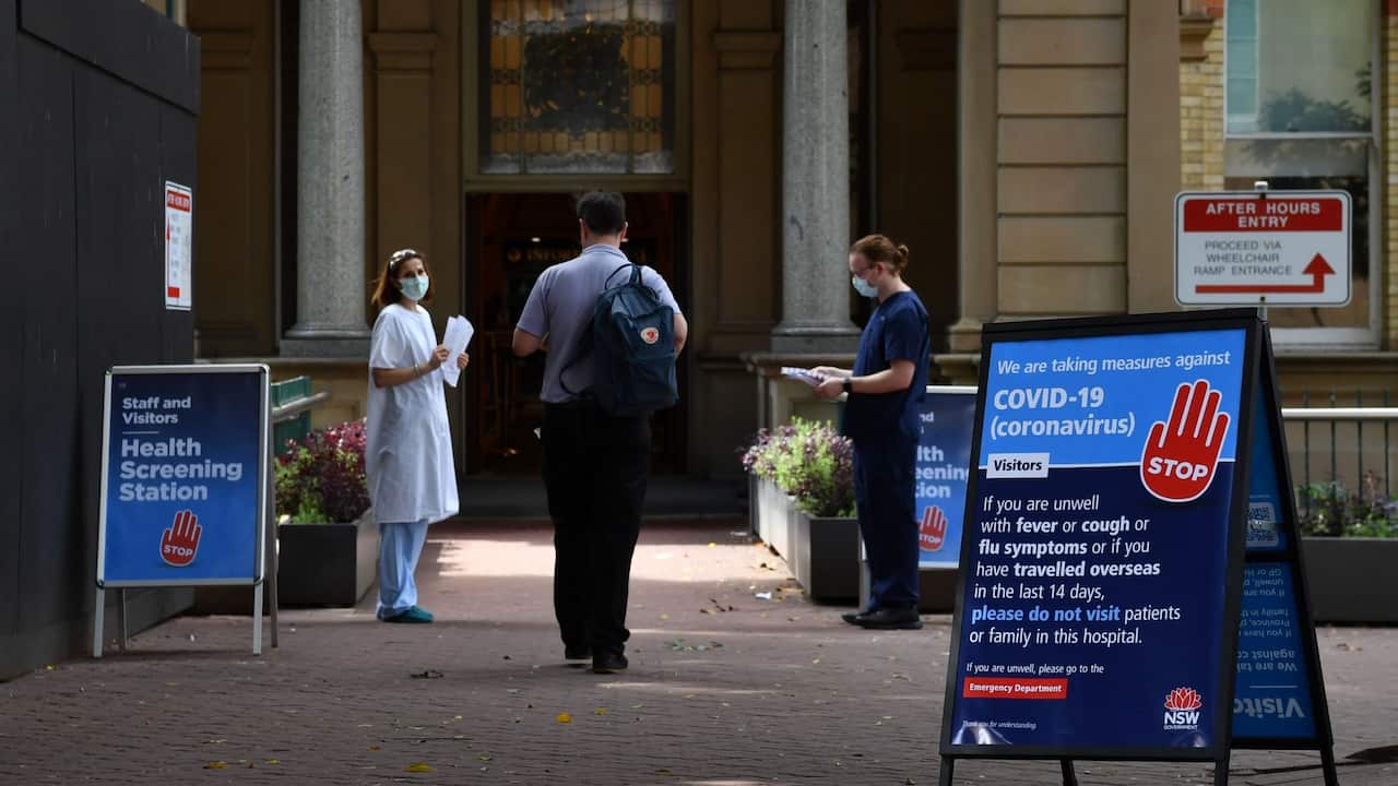 Staff wearing face masks outside the Royal Prince Alfred Hospital (RPA) in Camperdown, Sydney, Wednesday, March 25, 2020