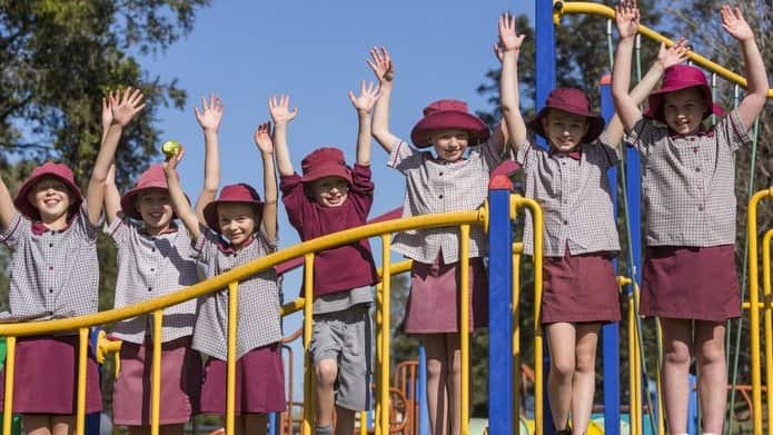 School Children Outdoors on Play Equipment