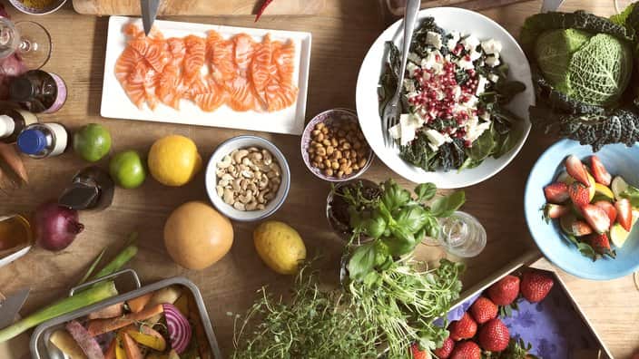 Fruits, vegetables, and seafood on a kitchen table
