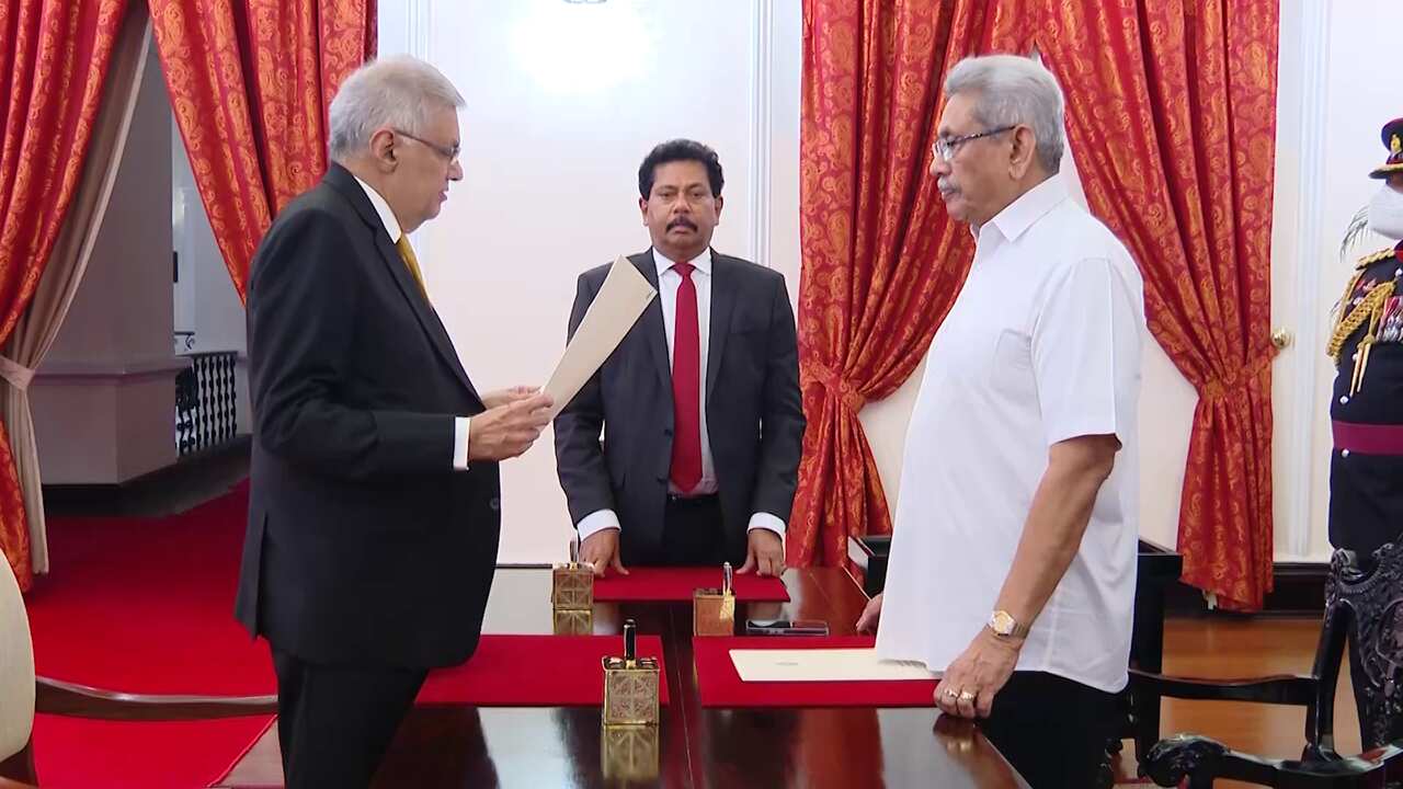 President Gotabaya Rajapaksa (right) greets Ranil Wickremesinghe during the latter's oath taking ceremony as the new prime minister, in Colombo.