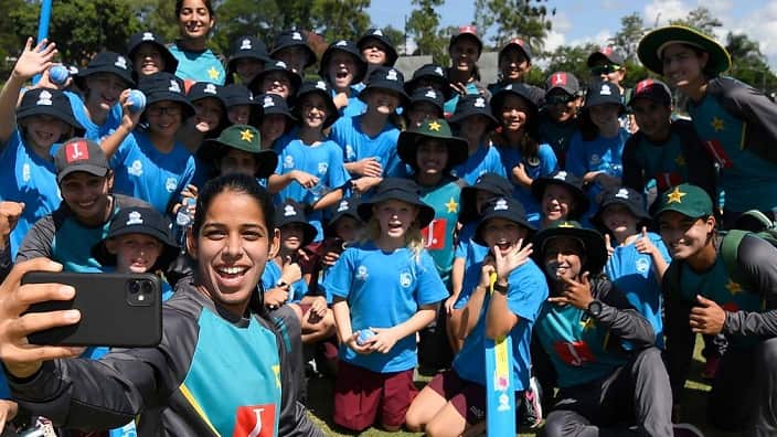 Players of the Pakistan national women's team pose for photos with young fans during the ICC Women's T20 Cricket World Cup Cricket 