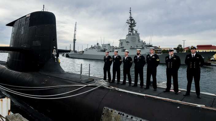 Navy personal stand on the HMAS Waller third of the six Collins class submarines in Sydney  
