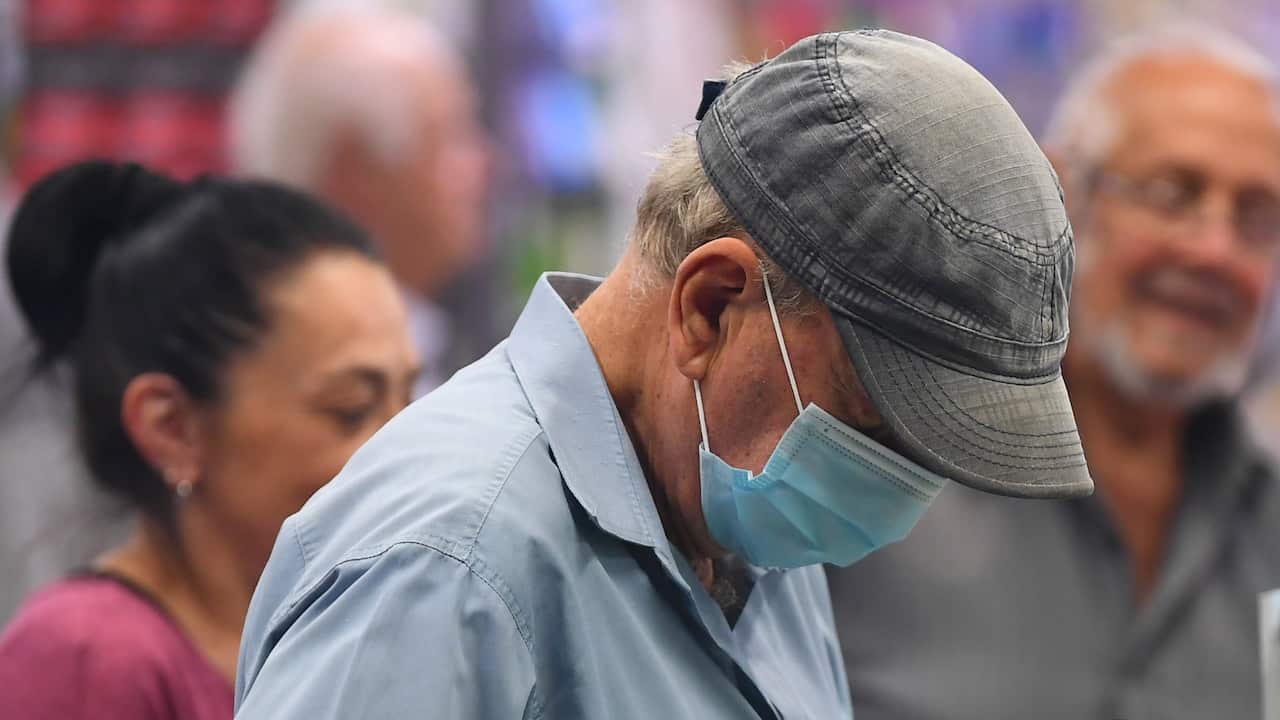 A man wears a face mask as a preventative measure against corona virus in Coburg, Melbourne,