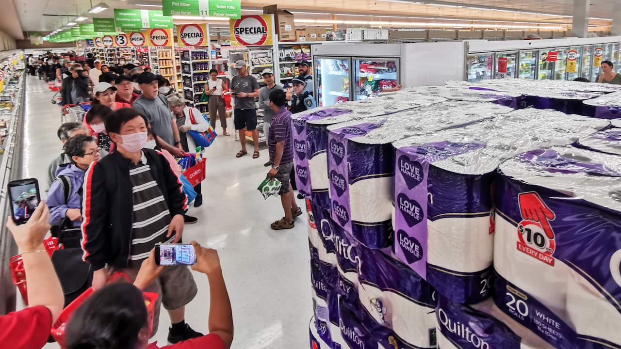 People awaiting their turn to purchase toilet paper, paper towel and pasta at Coles Supermarket, Epping in Sydney, Friday, March 20. 