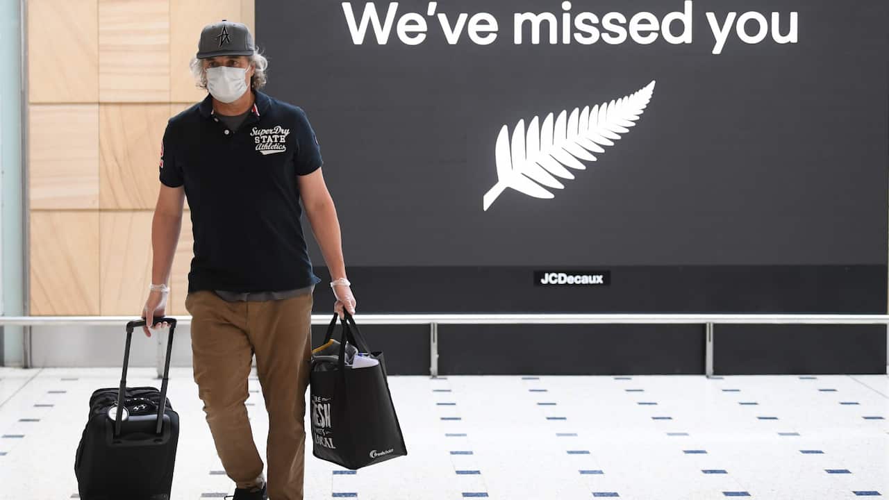 Passengers from New Zealand arrive at Sydney International Airport in Sydney, Friday, October 16, 2020. 