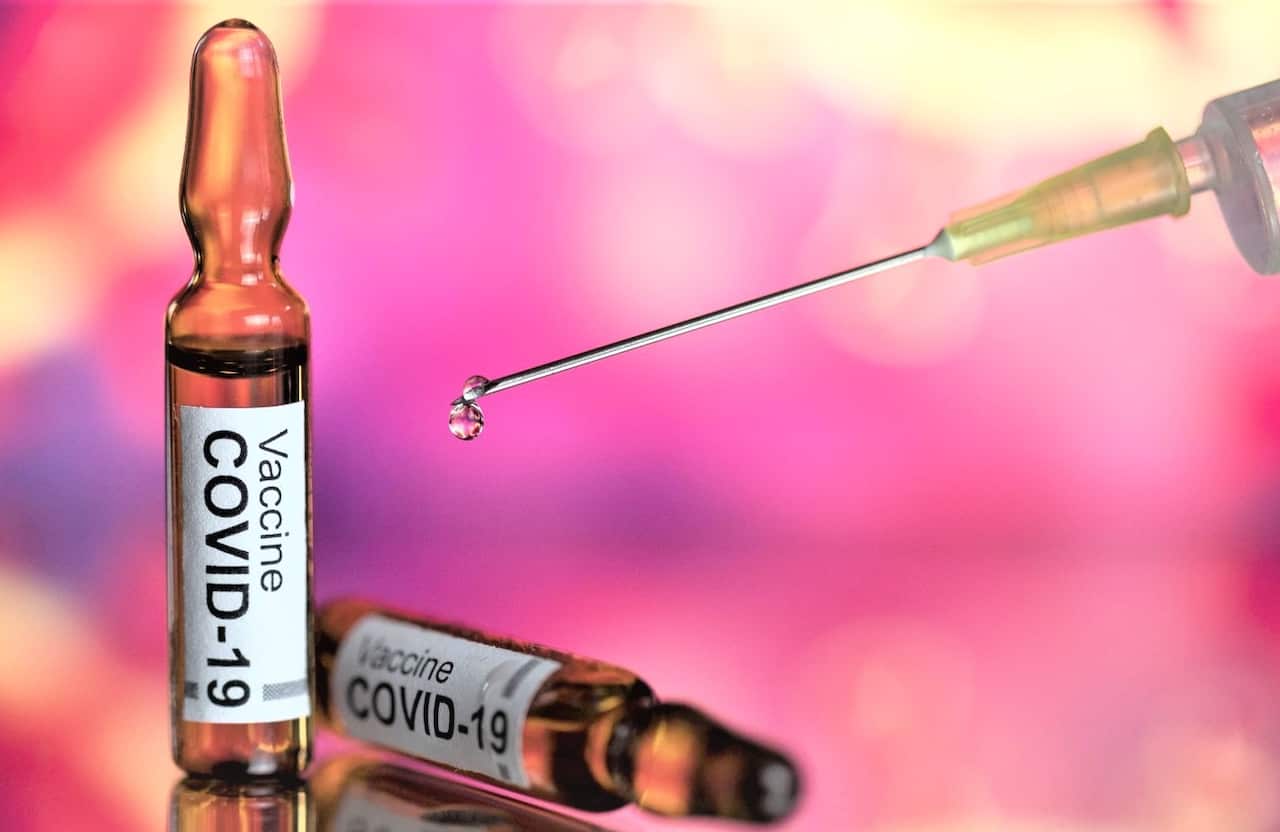 In this photo illustration, a syringe and ampules with fake covid-19 vaccine. 