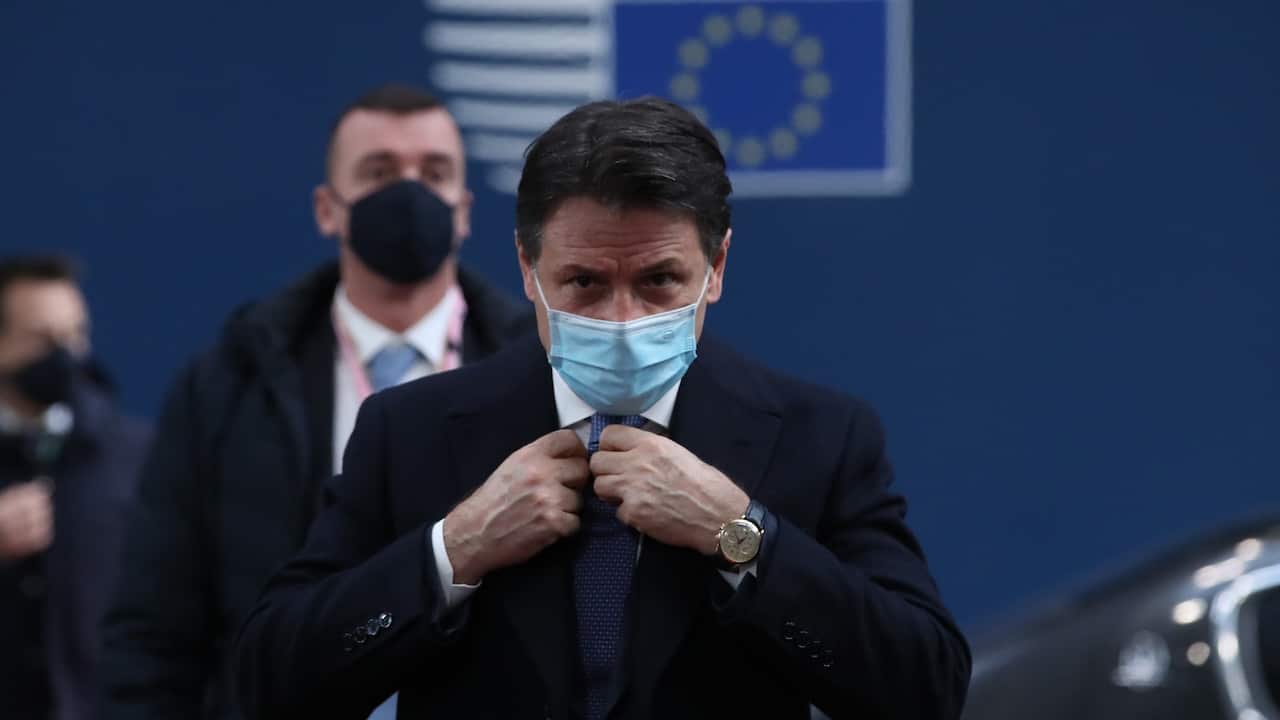 Italian Prime Minister Giuseppe Conte wearing a face 