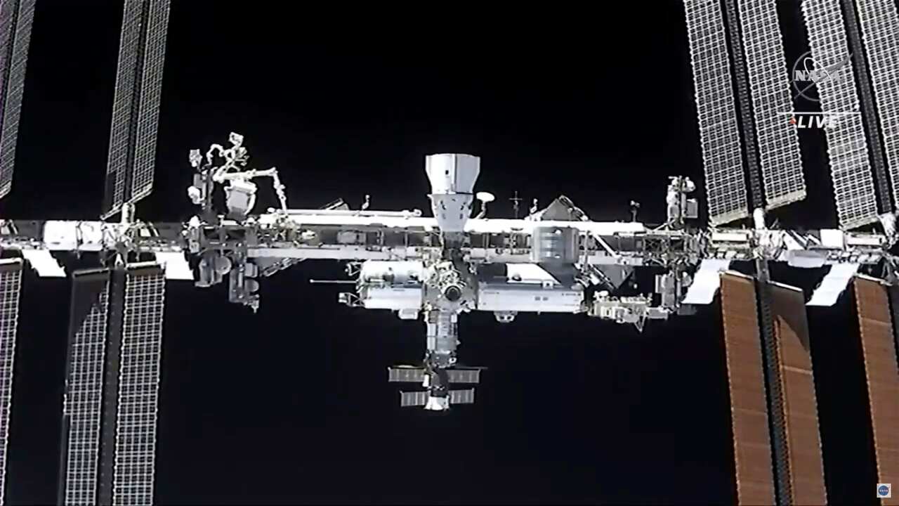 This image made from NASA TV shows the international space station, seen from the SpaceX Crew Dragon spacecraft Saturday, April 24, 2021