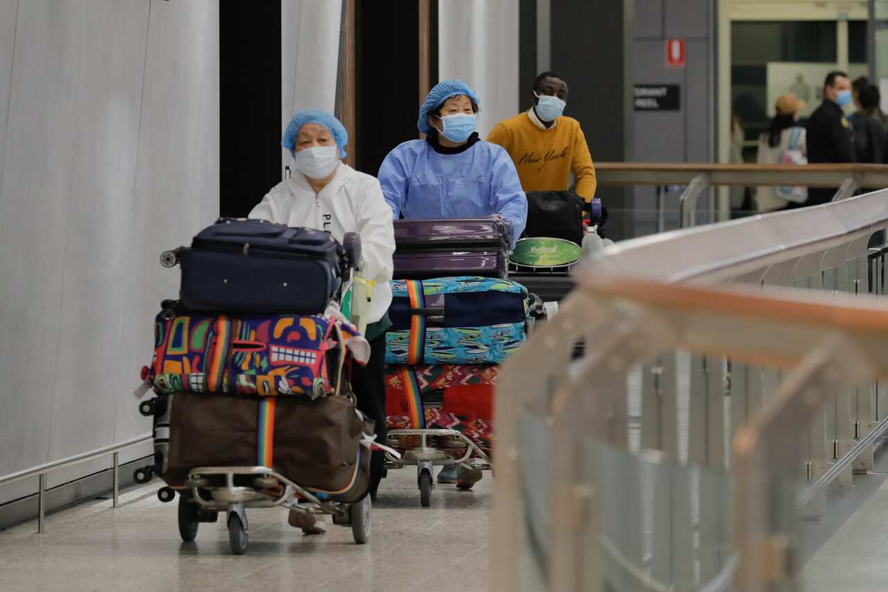 Passengers are seen arriving at Melbourne International Airport in Melbourne, 