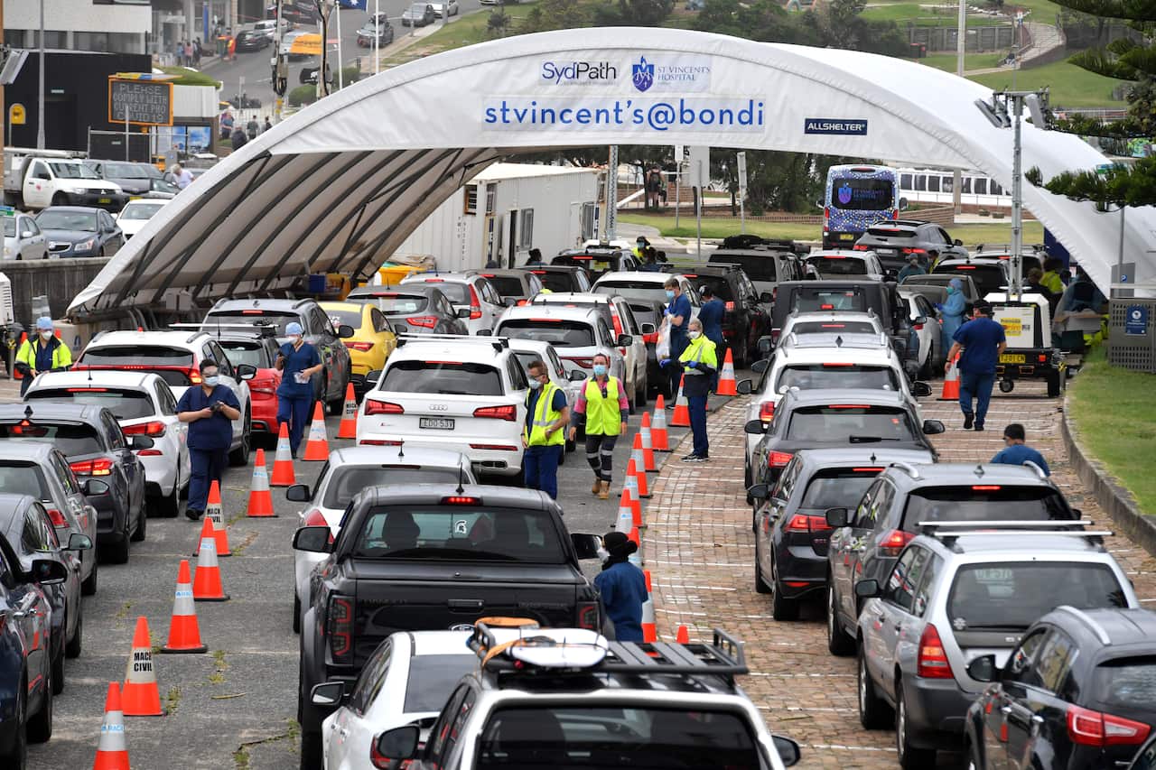 Members of the public queue for Covid19 PCR tests at a clinic at Bondi Beach in Sydney, Monday, December 27, 2021. 