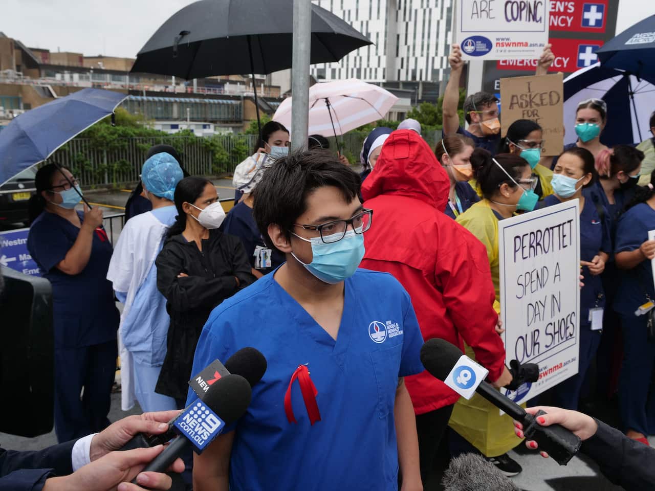 Westmead Hospital nurse Timothy Blofield speaks to reporters outside Westmead Hospital in Sydney, Wednesday, January 19, 2022. (AAP Image/Sam McKeith) NO ARCHIVING